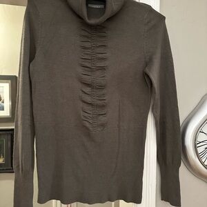 Turtleneck with Ruching Detail. European inspired styling. High quality knit.